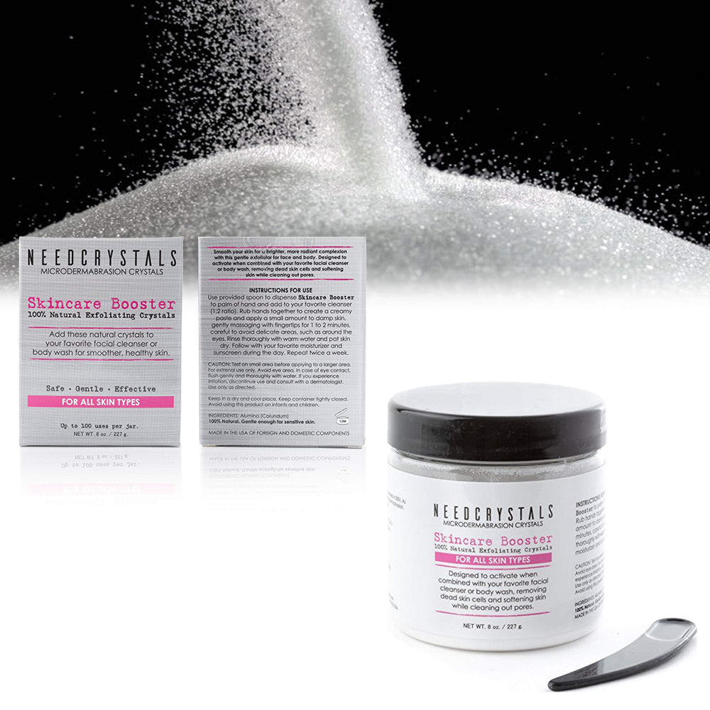 NeedCrystals facial exfoliator spread on skin showing smooth texture