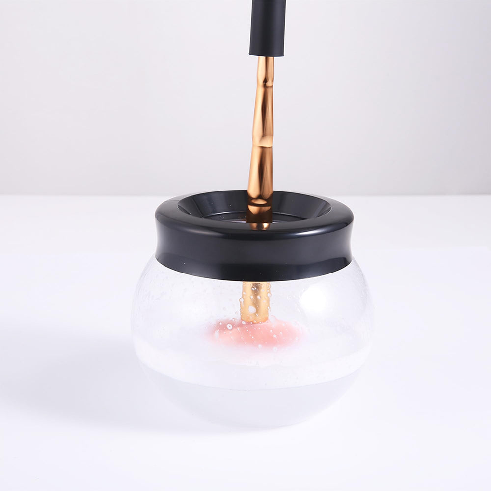 Neeyer makeup brush cleaner dryer in use spinning and drying brushes quickly.