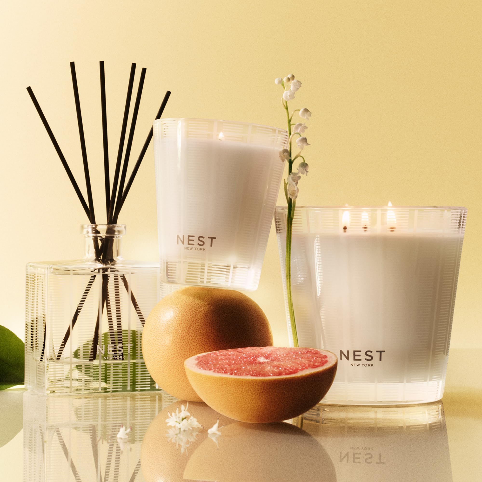 NEST New York Grapefruit Liquid Soap glass bottle on sink with soft lighting