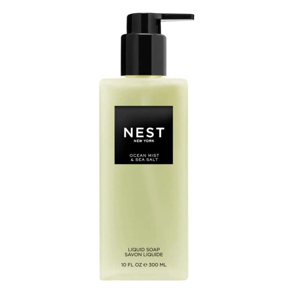 NEST New York Ocean Mist bottle pour, refreshing cleanse at sink.