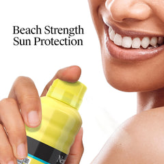 Sunscreen spray on beach towel ready for sun sessions by the shore
