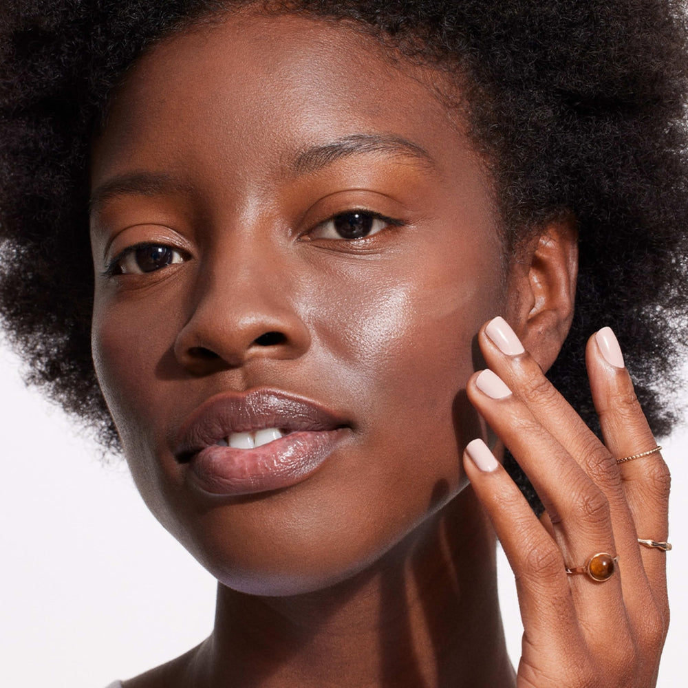 Neutrogena Purescreen Vitamin E closeup shows nourishing, skin-softening formula.