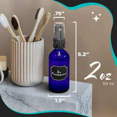 Nevlers blue glass spray bottle 2oz side view with fine mist nozzle.