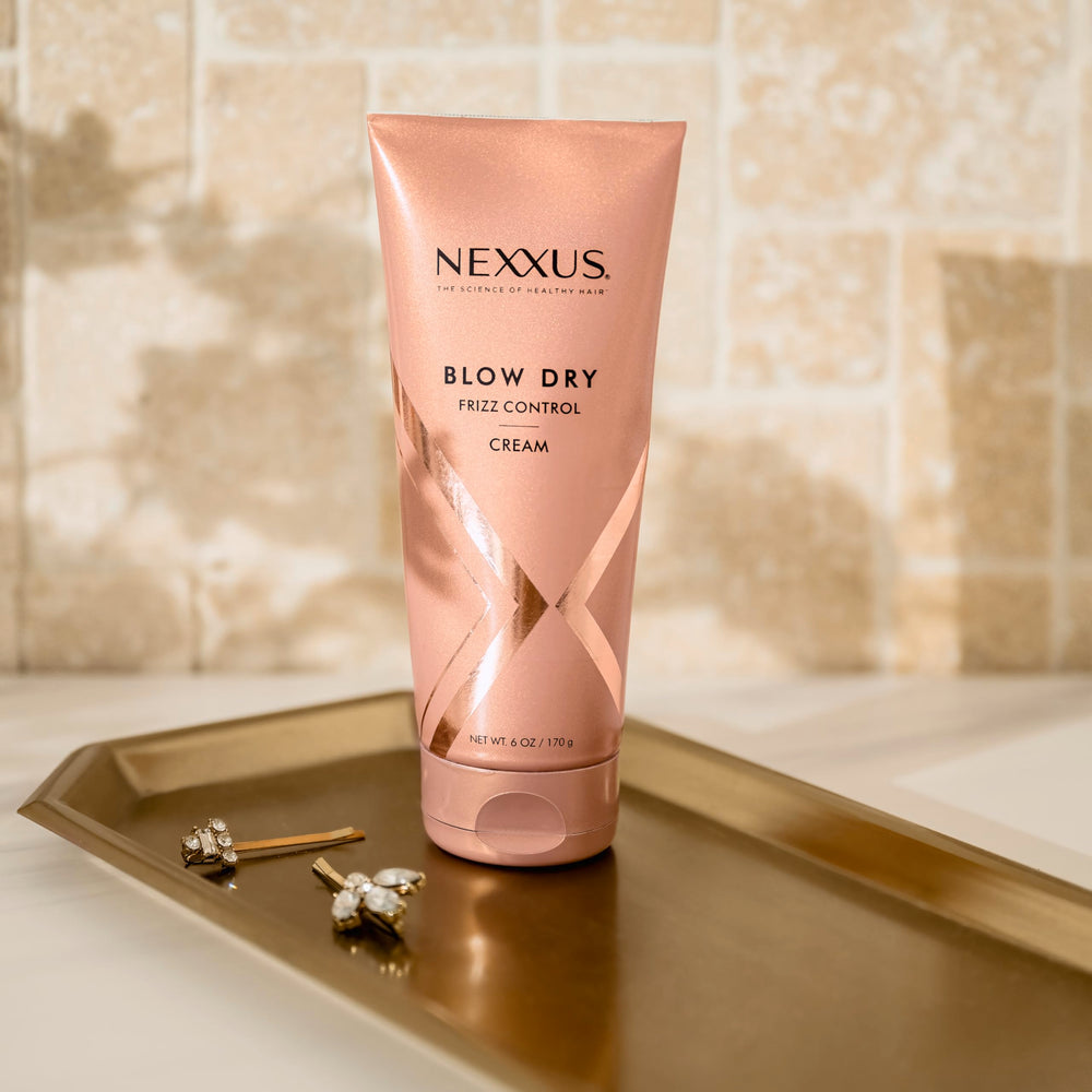 Nexxus round brush blowout with cream for body and smoothness.
