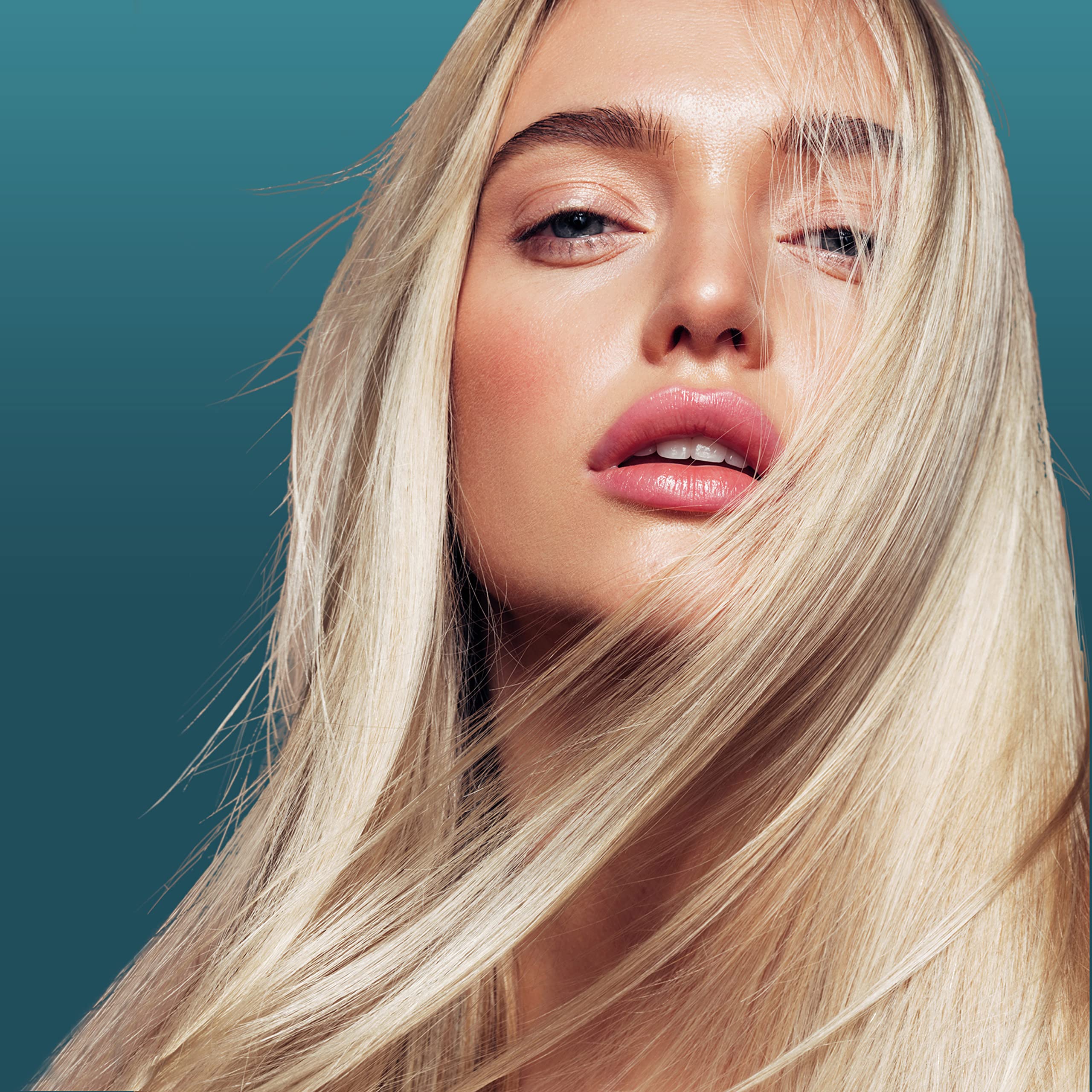 Nexxus Ultralight Smooth Conditioner bottle emphasizes conditioning boost without weighing hair down.