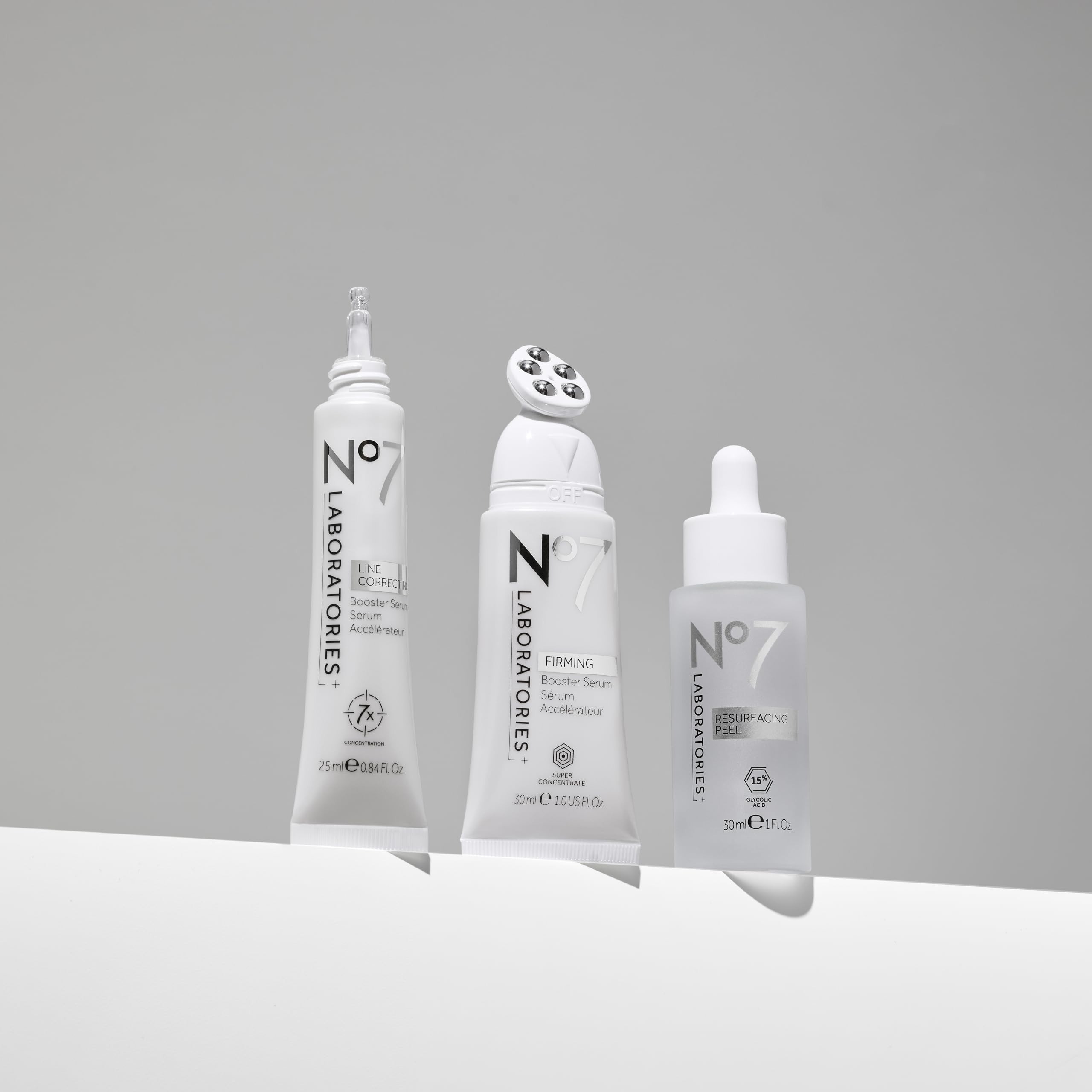 No7 Firming Booster Serum applicator-down demonstrates precise jawline and neck application.
