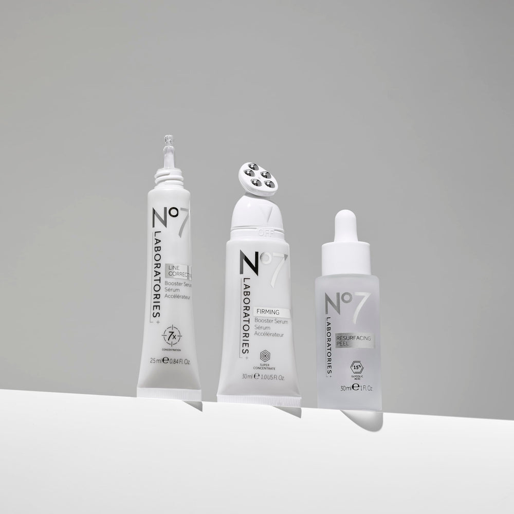 No7 Firming Booster Serum applicator-down demonstrates precise jawline and neck application.