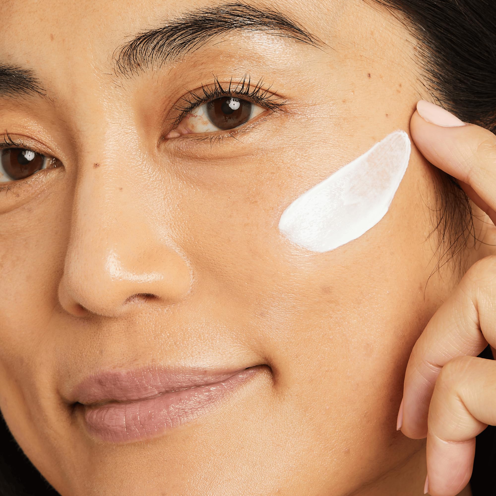 No7 Lift & Luminate day cream applied on skin with visible blend and glow.