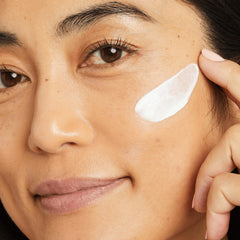 No7 Lift & Luminate day cream applied on skin with visible blend and glow.