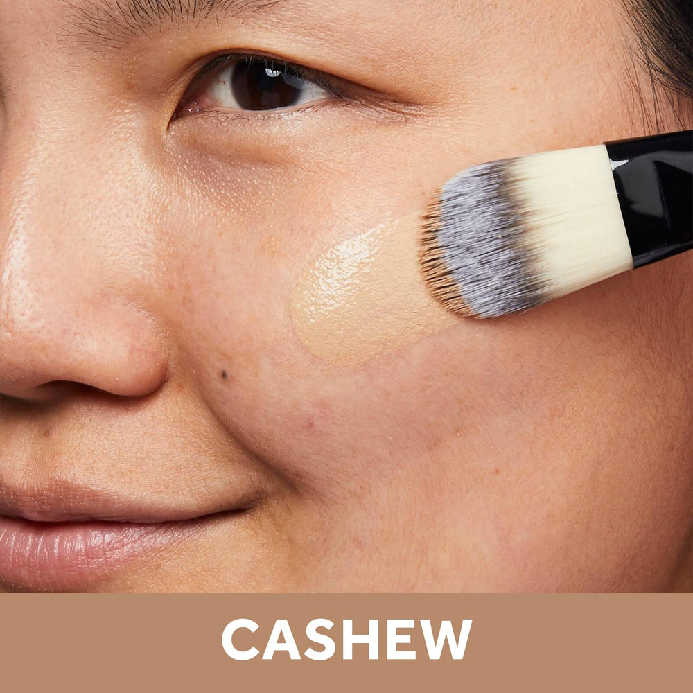 No7 Lift & Luminate foundation bottle closeup emphasizes dewy base for mature skin.