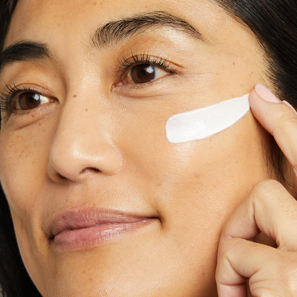 No7 Restore & Renew neck-application shot demonstrates firming care