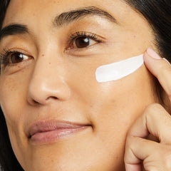 No7 Restore & Renew neck-application shot demonstrates firming care