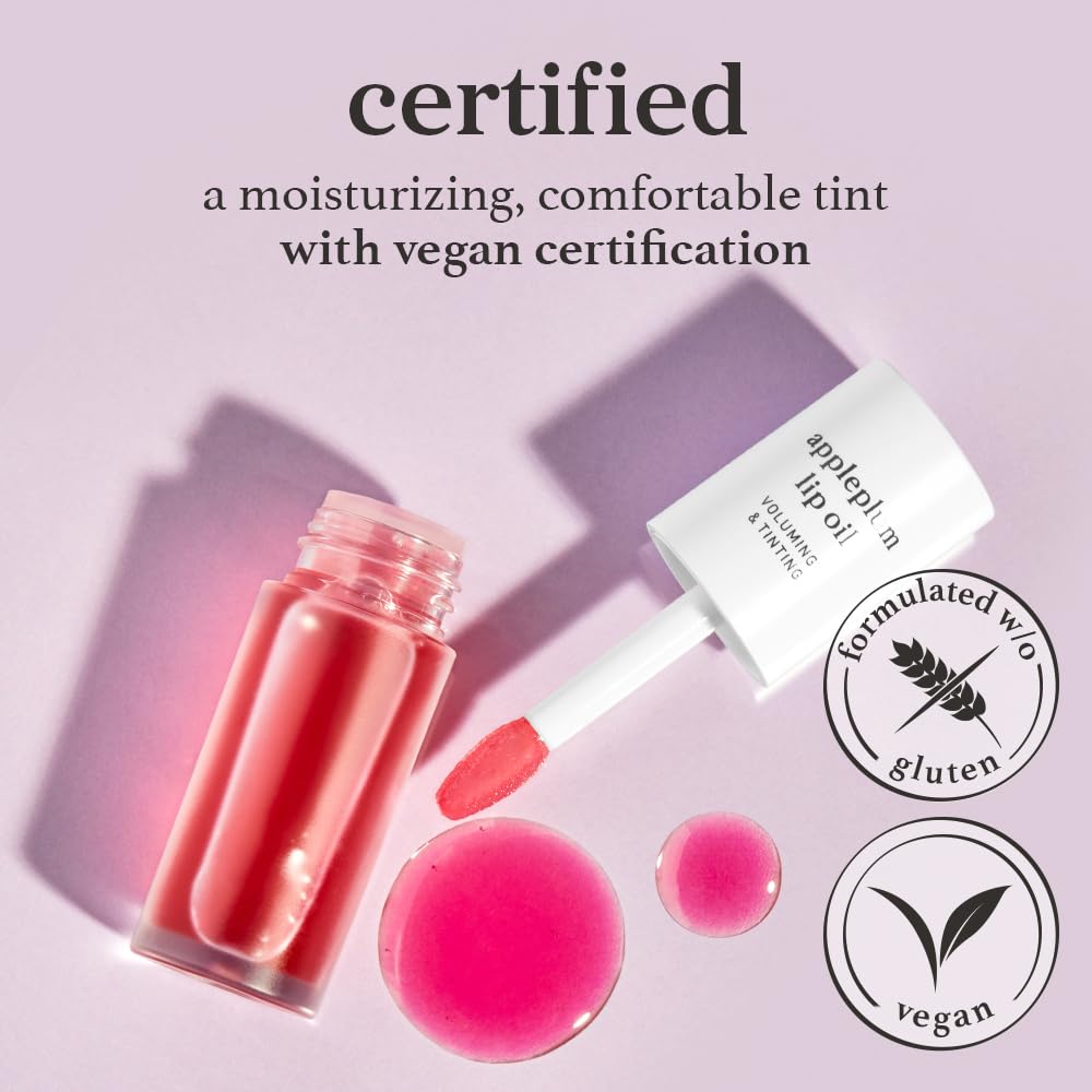 Applying NOONI Appleplum lip oil for silky lip nourishment