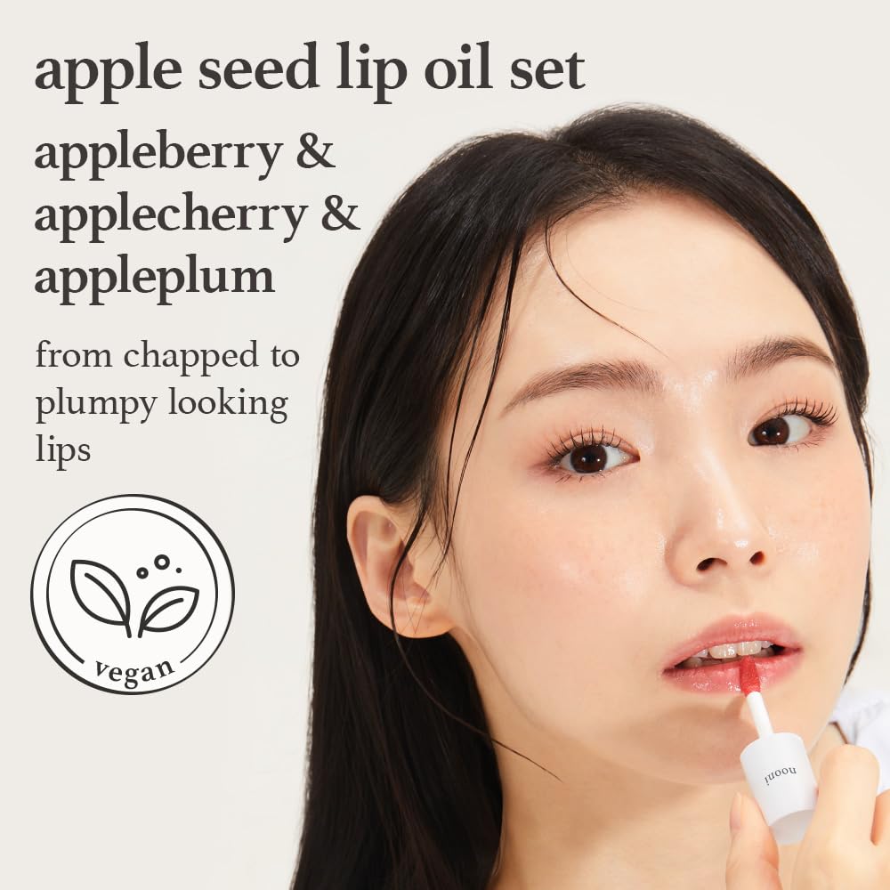 NOONI Appleseed Lip Oil Appleplum bottle closeup highlights vibrant shine.