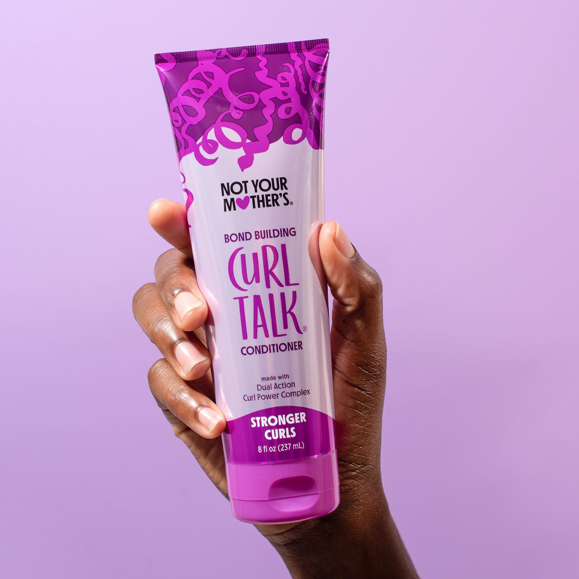 Not Your Mother's Curl Talk conditioner being applied for deep hydration and frizz control.