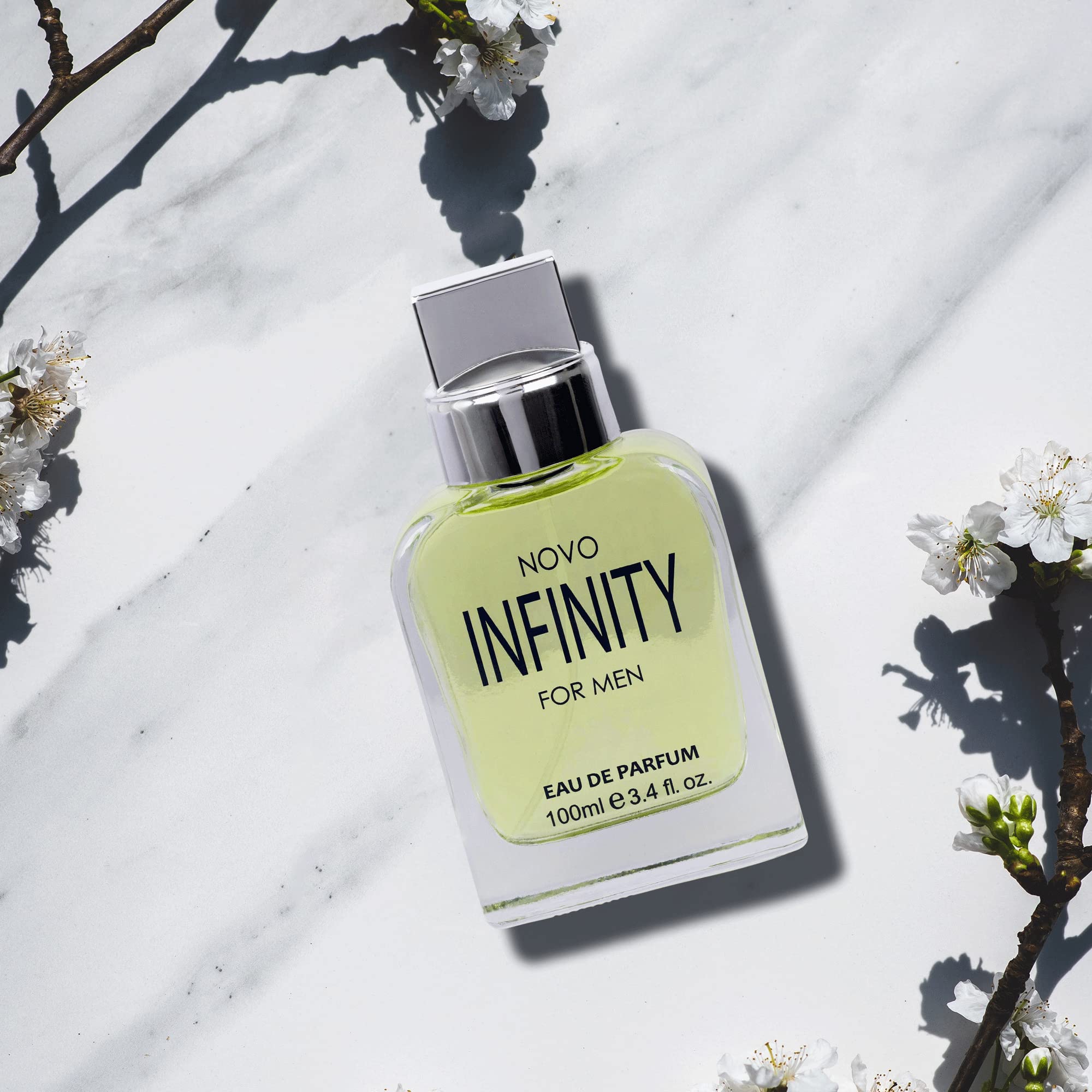 NovoGlow Infinity for Men top-notes citrus image suggests refreshing, versatile daytime scent