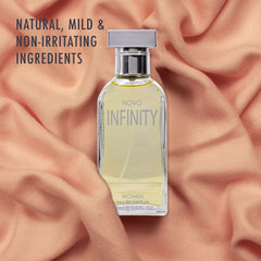 NovoGlow Infinity label closeup highlights premium notes and feminine branding.