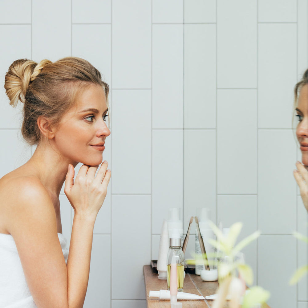 Nu Skin Rejuvenating Cream packaging display on vanity signals gentle, everyday hydration.