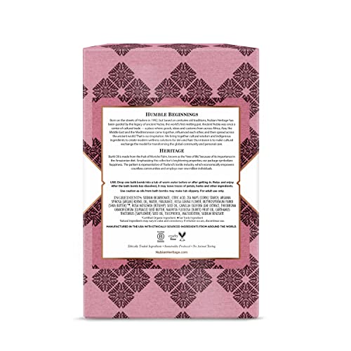 Nubian Heritage Patchouli Buriti bathbomb closeup releasing uplifting aroma during bath.