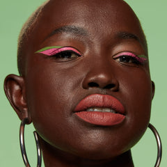 Precise-tip close-up on NYX Sneaky Pink for clean definition.
