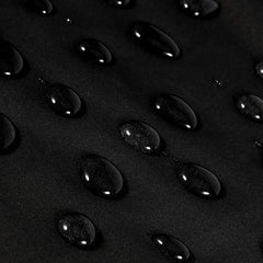 Oak Leaf hair cutting cape fabric close-up highlighting water-resistant material.