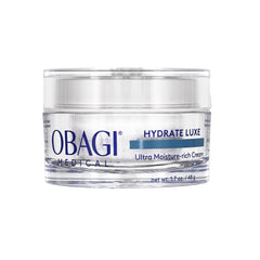 Obagi Hydrate Luxe night cream balm texture shown on a bathroom shelf for deep overnight hydration