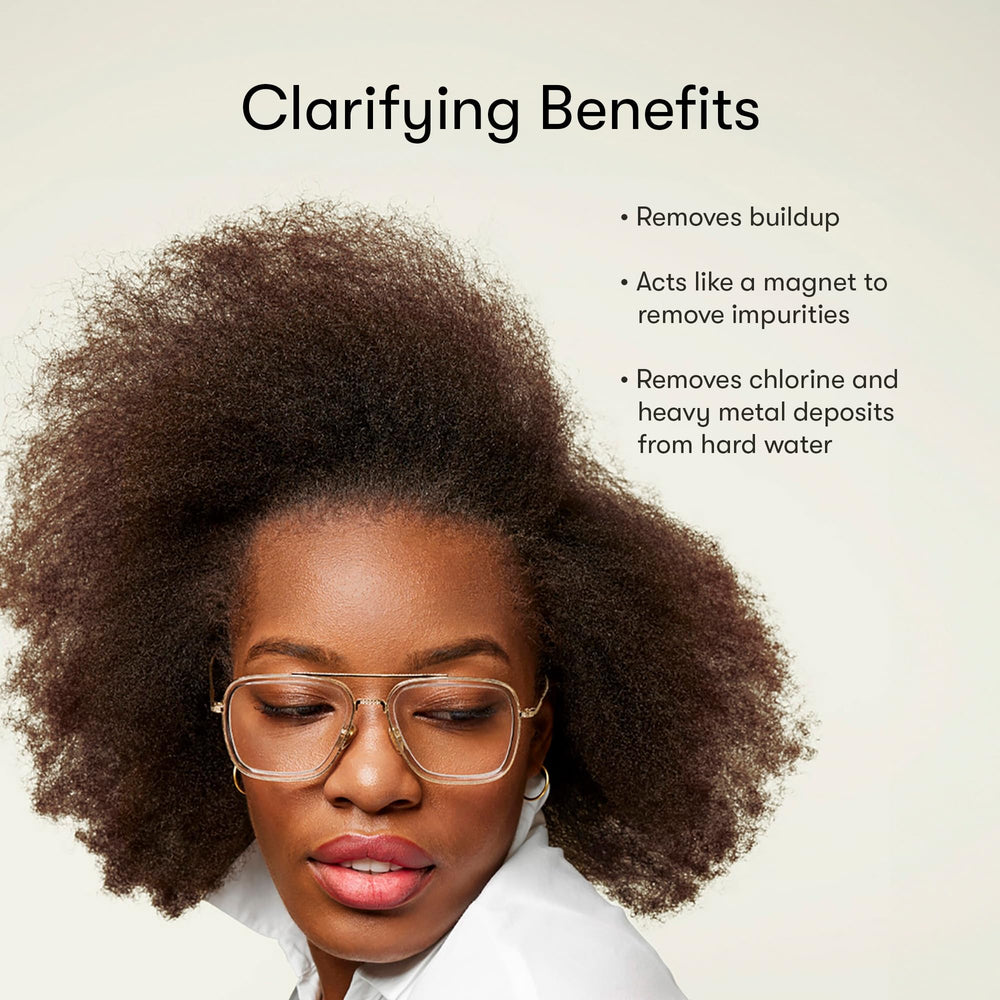 Odele Clarifying Shampoo pump bottle with water droplets suggests weekly deep-clean ritual