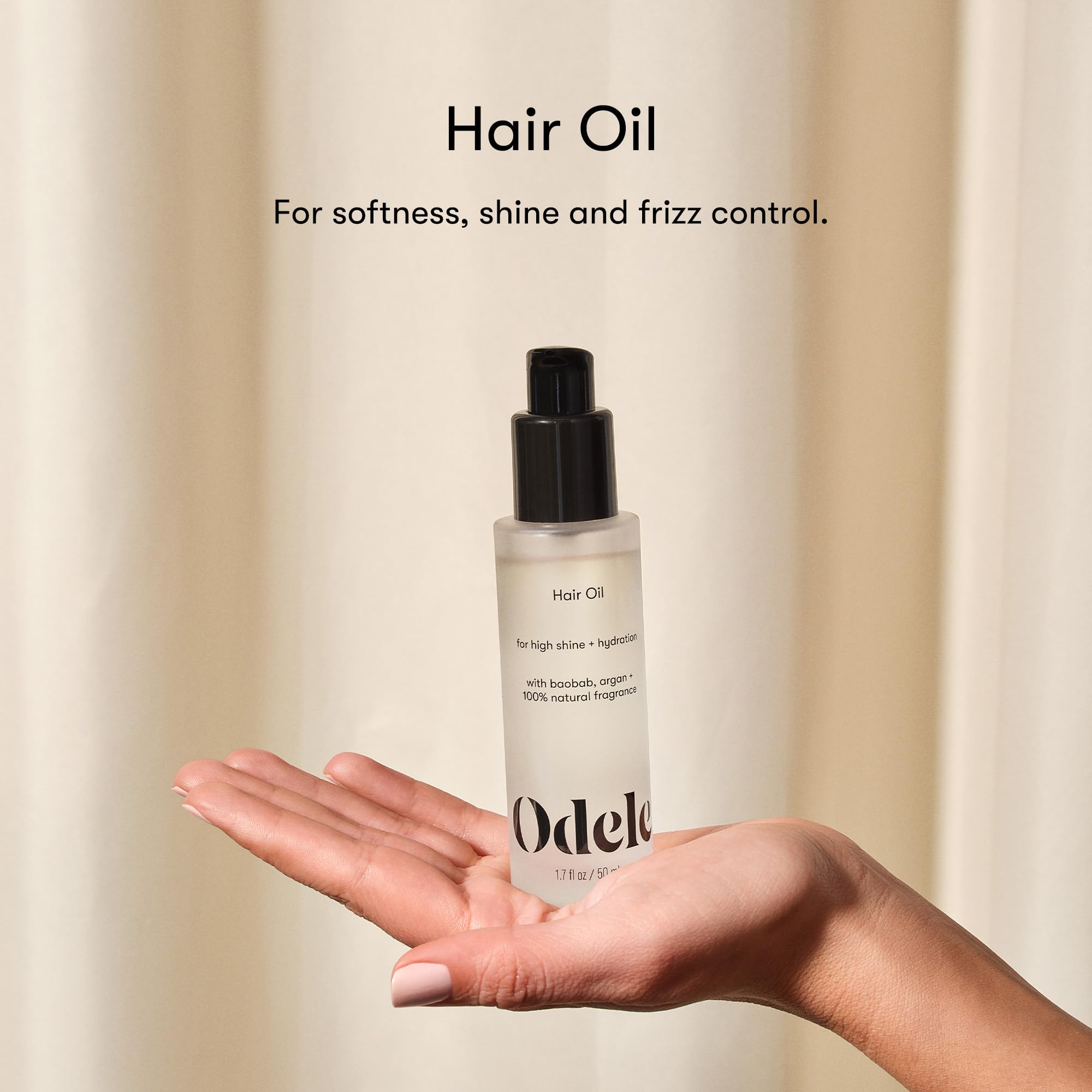 Close-up of glossy hair after Odele oil showcasing shine and smoothness
