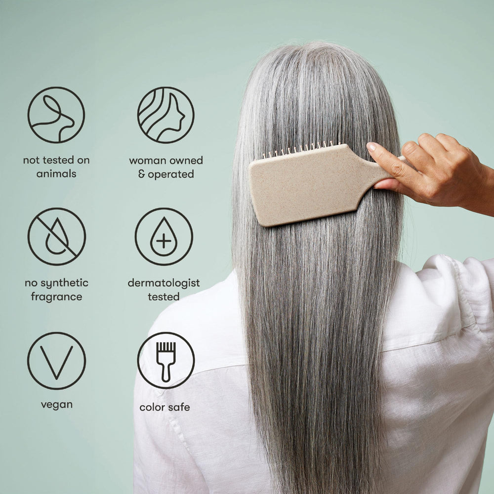 Odele Smoothing Conditioner being applied to hair for detangling ease