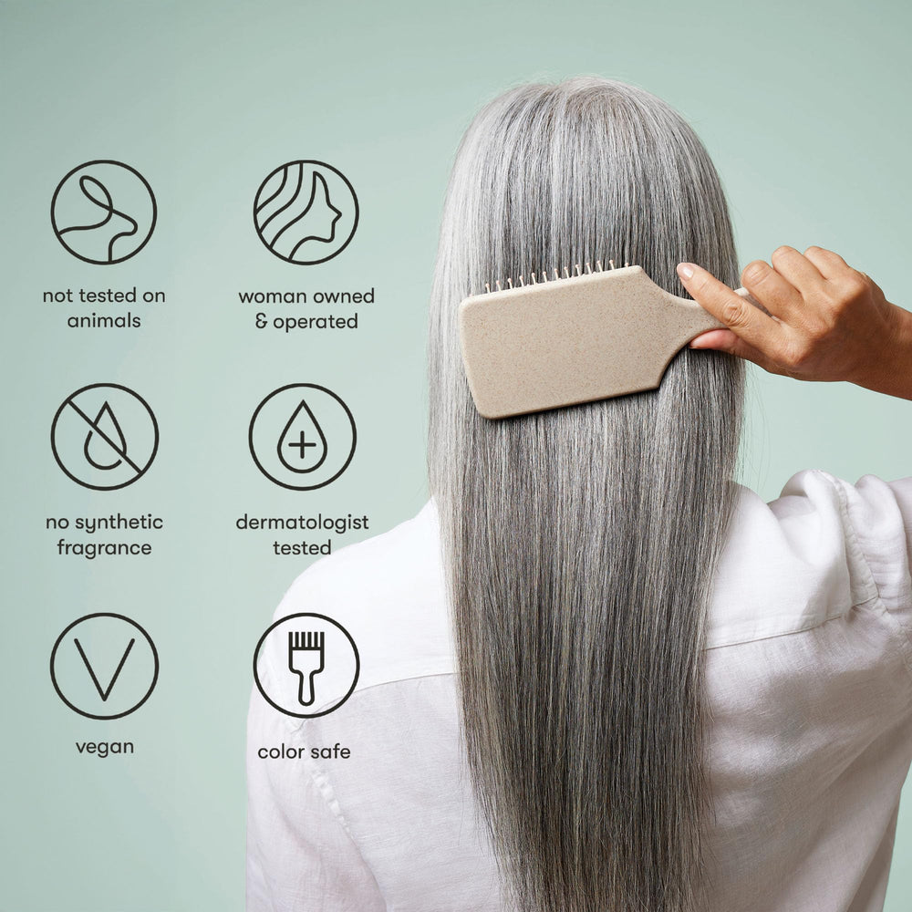 Odele Smoothing Shampoo texture on hair shows smoother strands after wash.