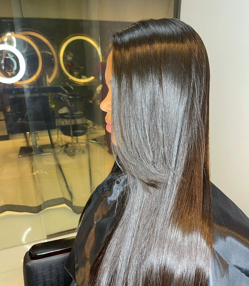 OGC straightening step using a flat iron for silky, durable straightness