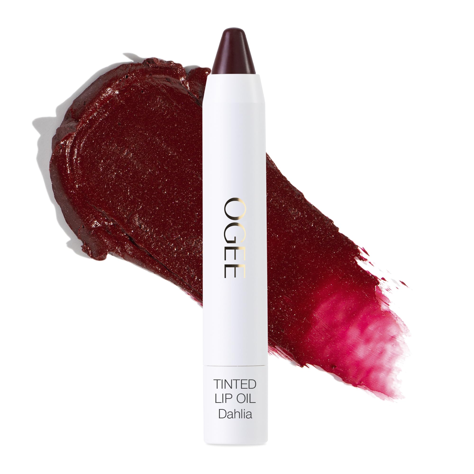 Ogee Dahlia lip oil tube application shows sheer burgundy tint and nourishing oils.