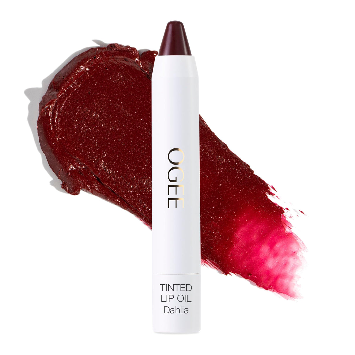 Ogee Dahlia lip oil tube application shows sheer burgundy tint and nourishing oils.