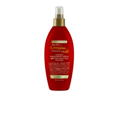 OGX Frizz-Free Keratin Smoothing Oil bottle shows frizz control and shine