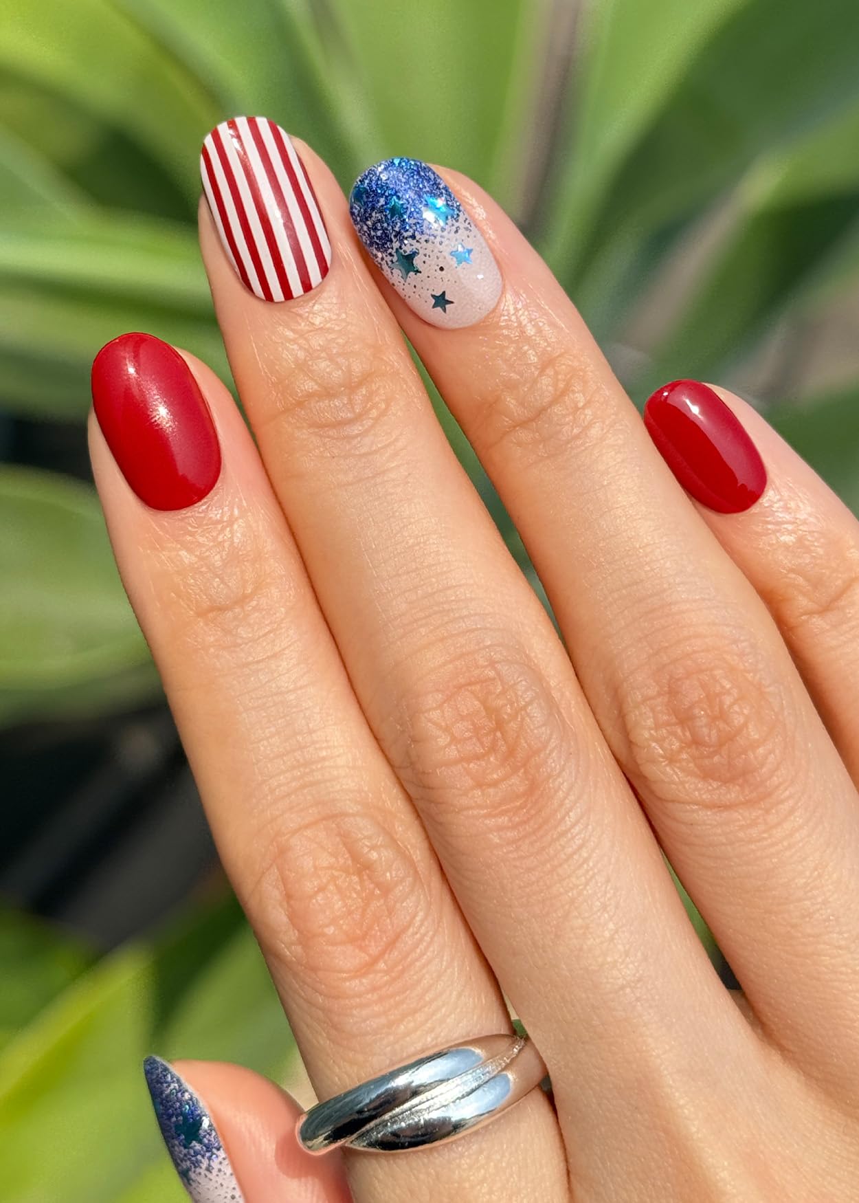 ohora N Spangled Burst wraps on nails with glittery finish for a bold manicure