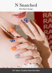 ohora nsnatched nails-on-hand shows blue patterned strips for quick salon-style result.