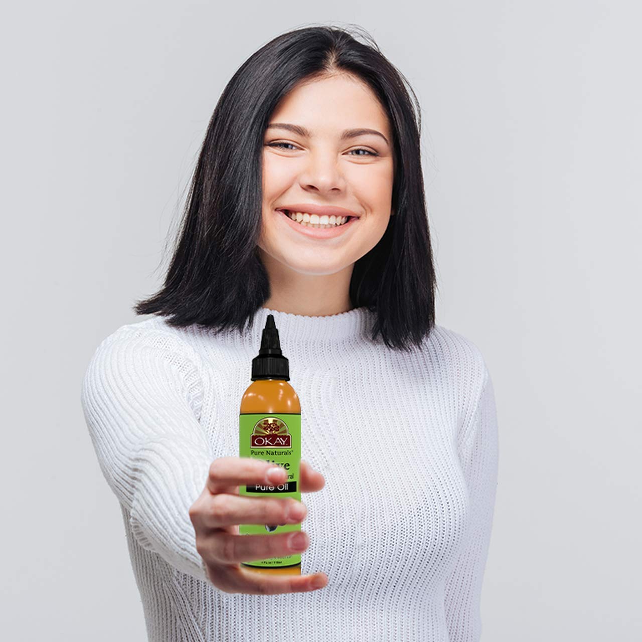 OKAY olive oil natural-nourishment close-up highlights multi-use beauty oil.