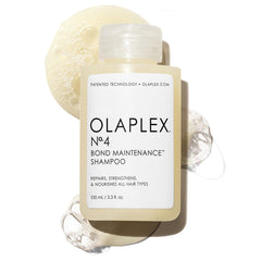 Olaplex N4 bottle with rich lather demonstrates hydration and smoother hair.