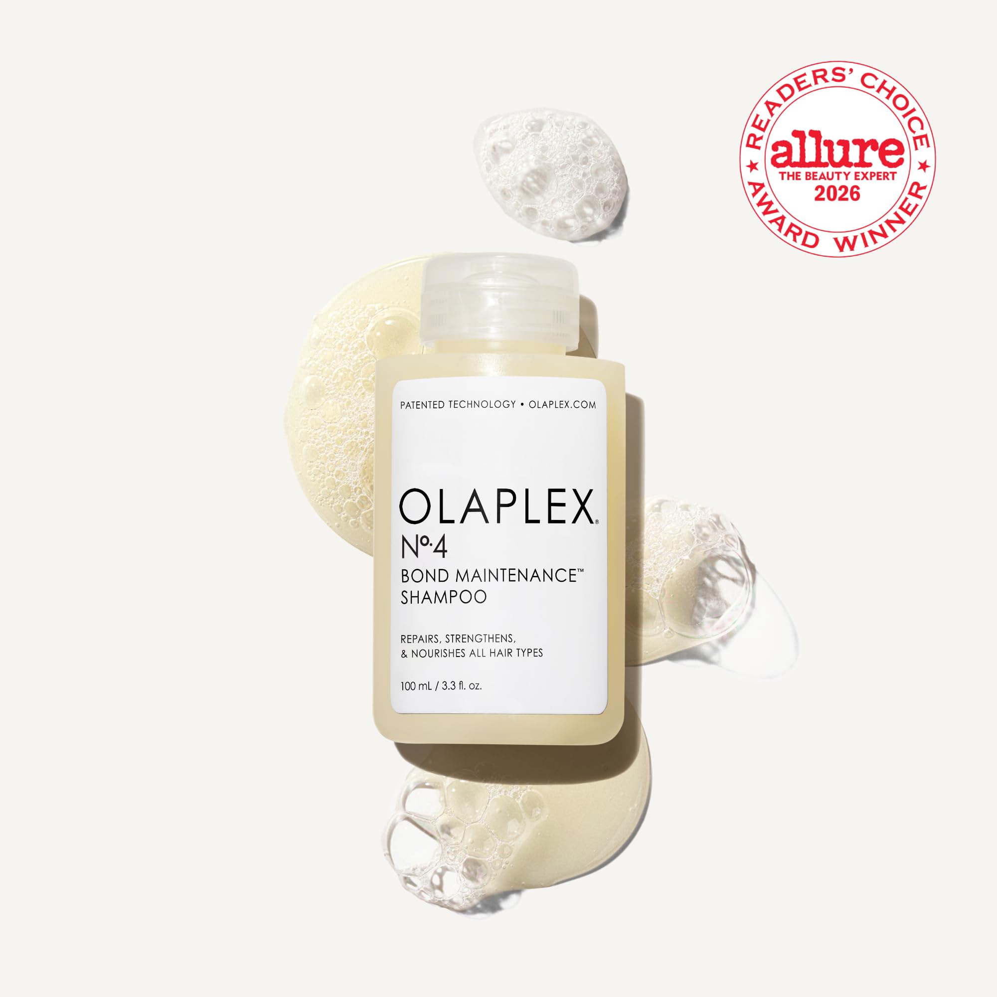 Olaplex N4 shampoo lather on fingers suggests soft cleansing that won’t strip moisture.