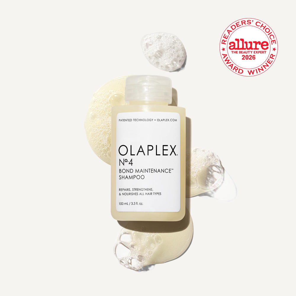 Olaplex N4 shampoo lather on fingers suggests soft cleansing that won’t strip moisture.