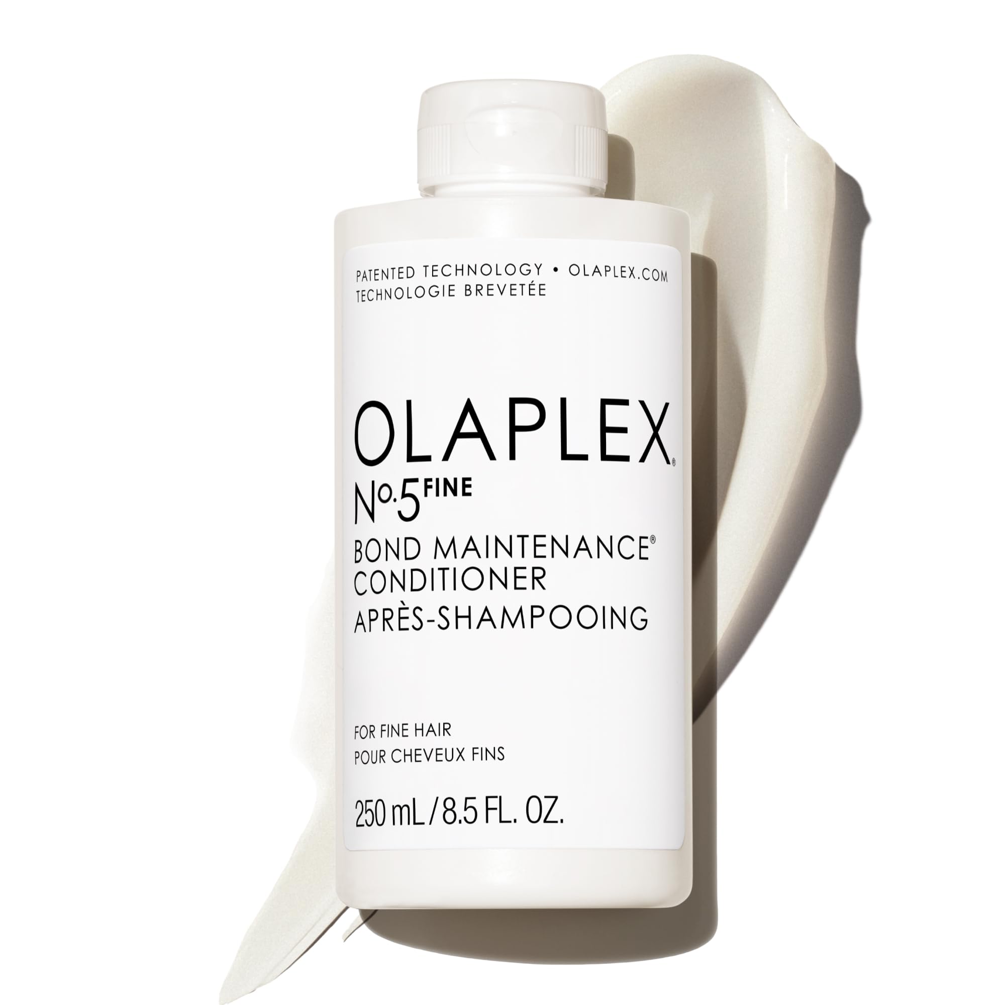 Olaplex Nº.5FINE bottle on bathroom shelf for weightless hydration.