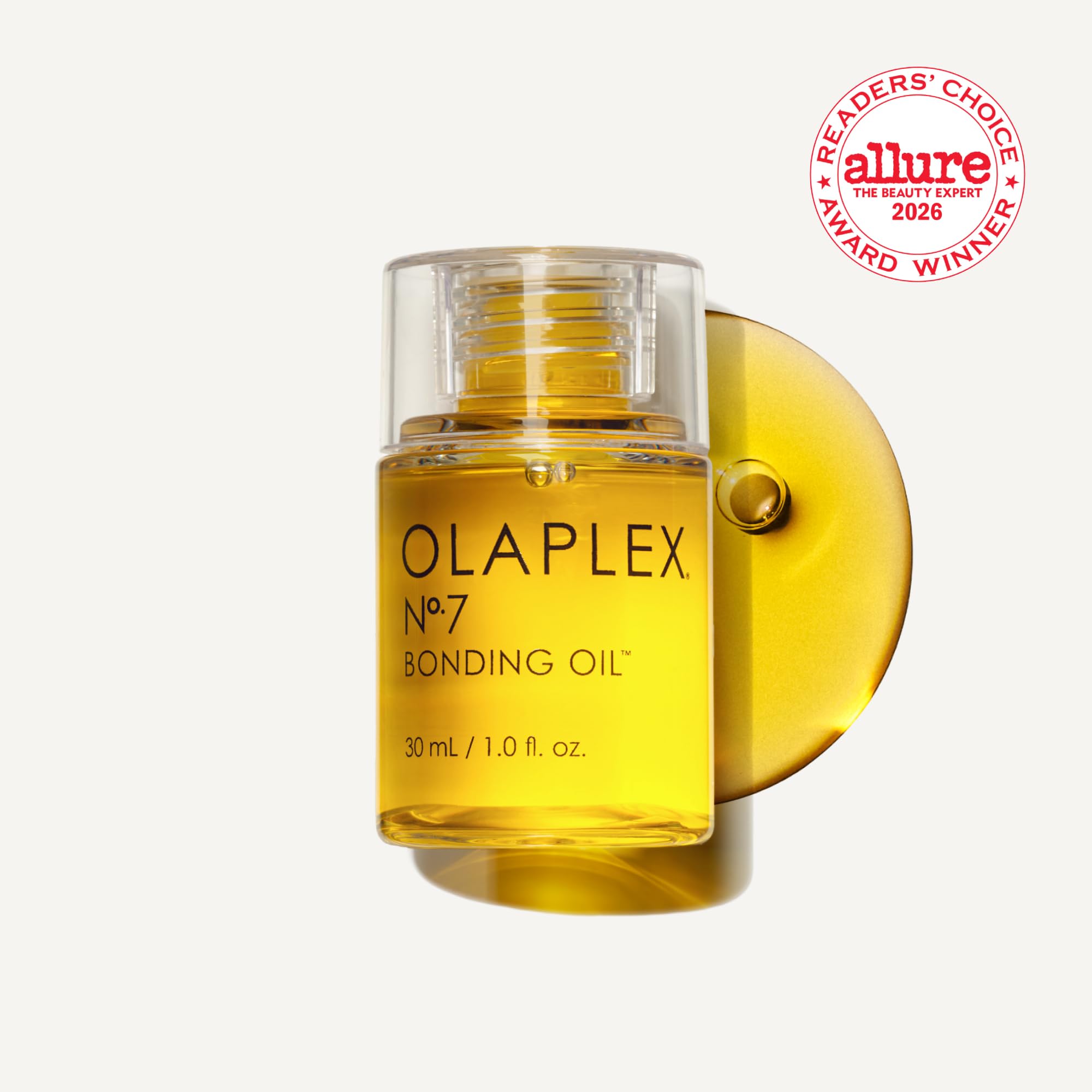 Olaplex No.7 Bonding Oil being applied to hair for smooth, glossy finish.