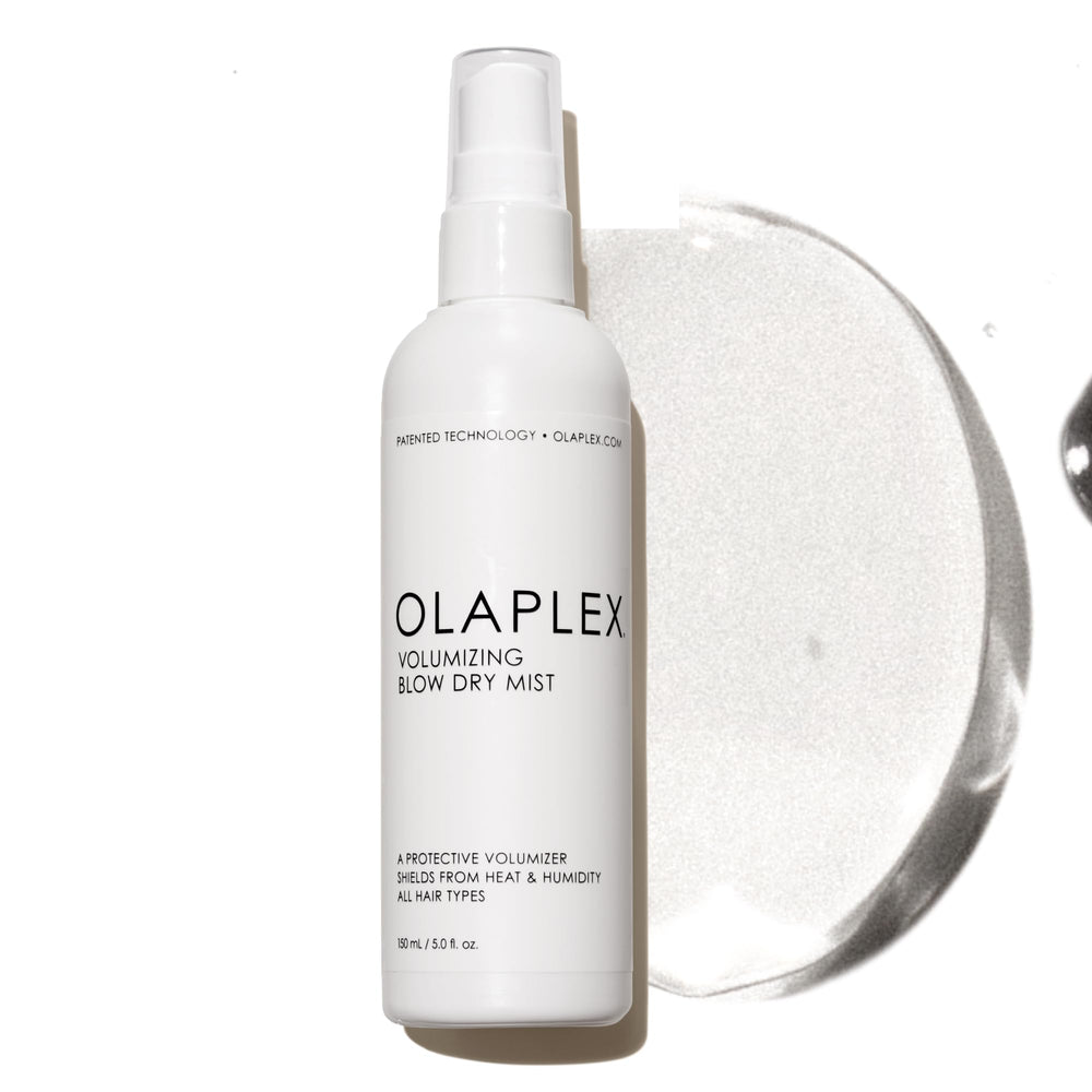 Olaplex Volumizing Blow Dry Mist bottle pour for weightless volume and shine.
