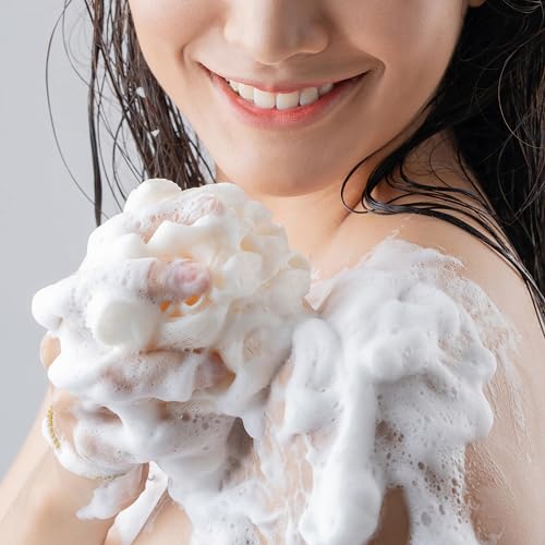 OLAY Ultra Moisture Body Wash lather spreading across skin for hydrated feel.