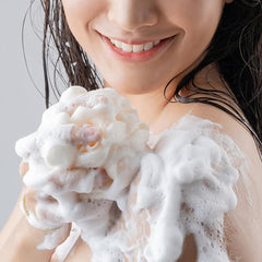 OLAY Ultra Moisture Body Wash lather spreading across skin for hydrated feel.