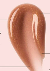 Ole Henriksen lip treatment swatch showcases Creme Brulee Glimmer shimmer.