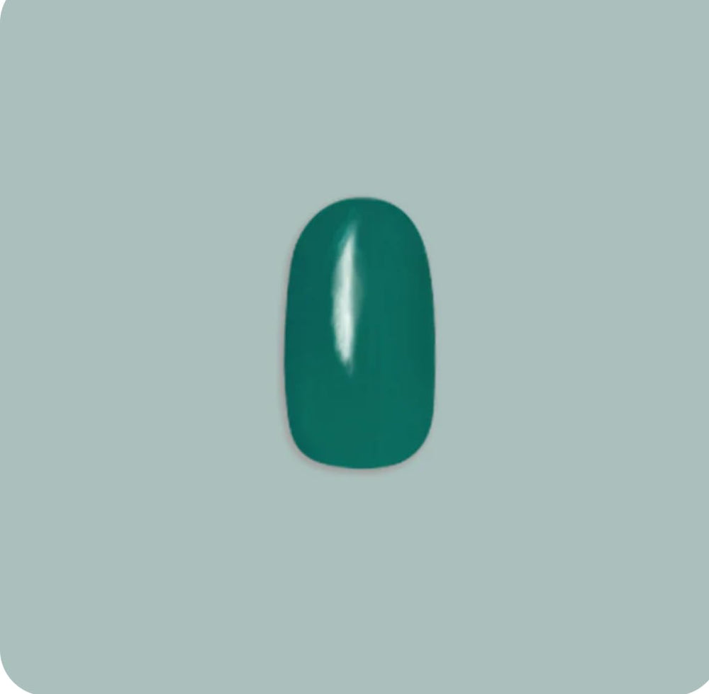 Olive & June emerald-green short-round nails brighten everyday looks.