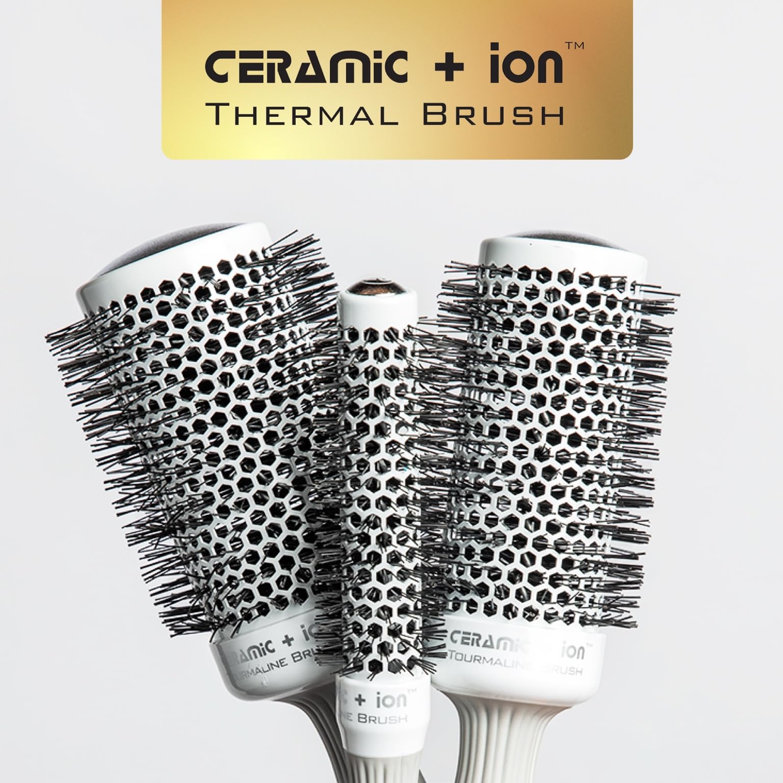 Olivia Garden retractable sectioning pick integrated into the round brush