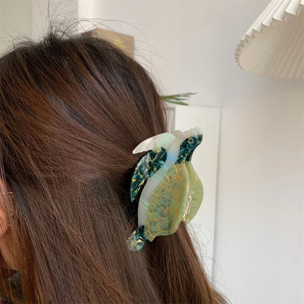 OMG Decor sea turtle clip side view in green, compact design fits various looks.