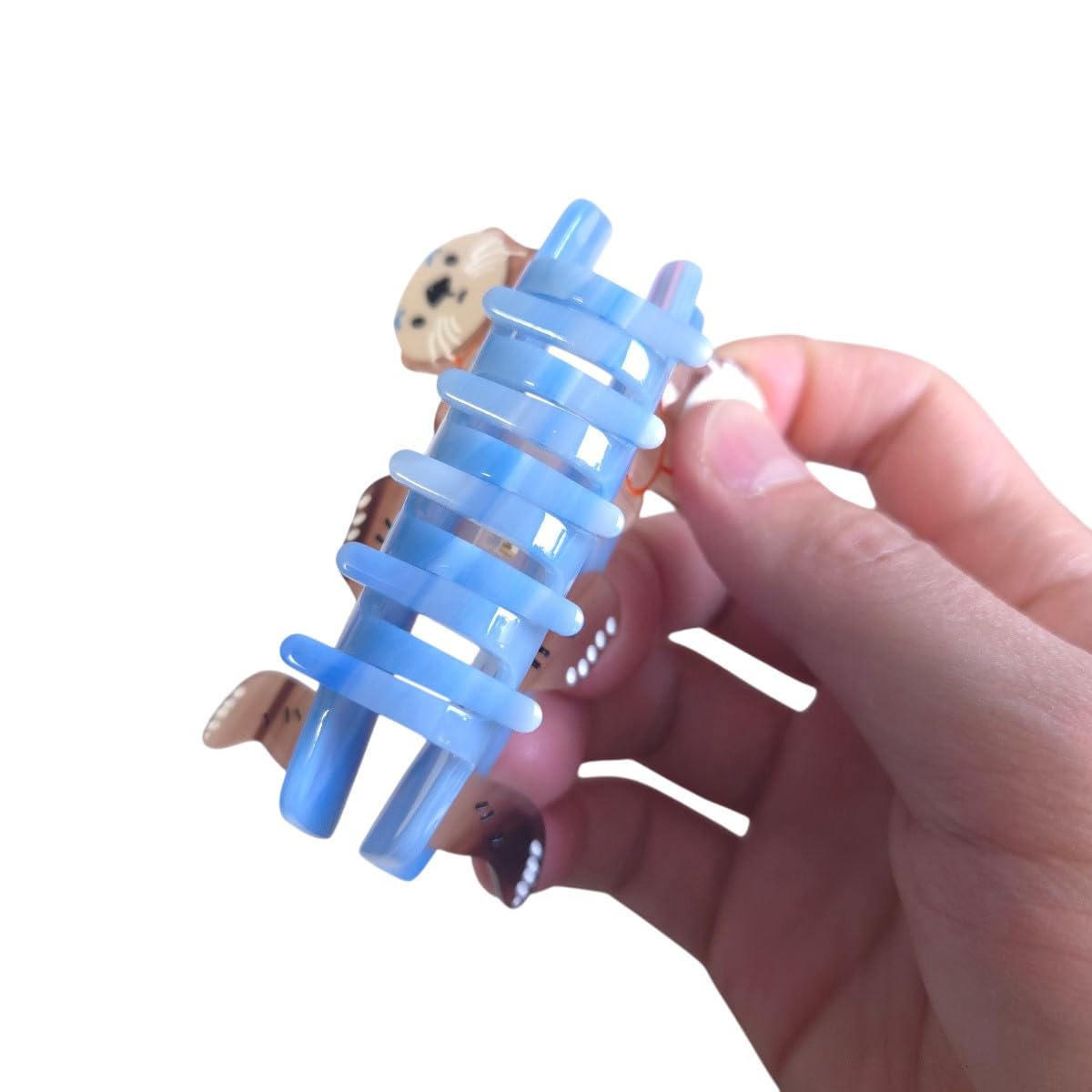 OMG Decor cute otter design clip complements outfits while keeping hair in place.